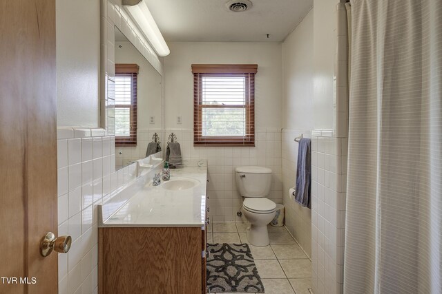 296 Redstone Dr, Bluff City, TN 37618 - full bathroom with toilet, vanity, tile patterned floors, wainscoting, and tile walls