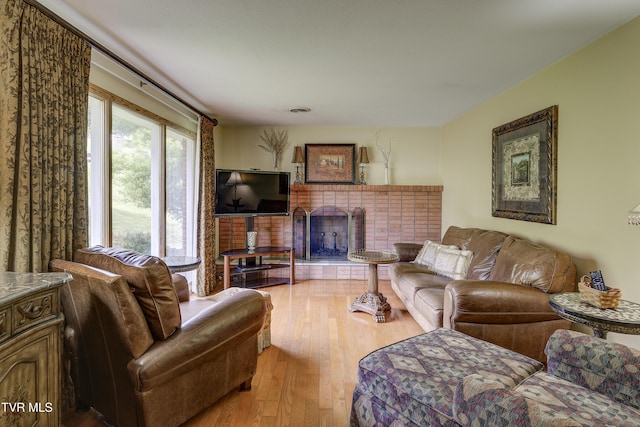 296 Redstone Dr, Bluff City, TN 37618 - living room with wood-type flooring and a fireplace