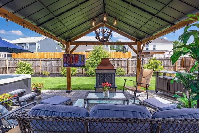 1058 Raccoon Ln, Piney Flats, TN 37686 - view of patio featuring a hot tub, a gazebo, and outdoor lounge area