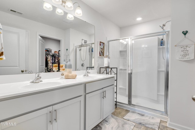 1058 Raccoon Ln, Piney Flats, TN 37686 - full bathroom with a shower stall, double vanity, and a spacious closet
