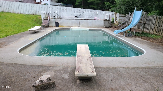1315 Lowe St, Elizabethton, TN 37643 - view of swimming pool featuring a water slide, a diving board, and a deck