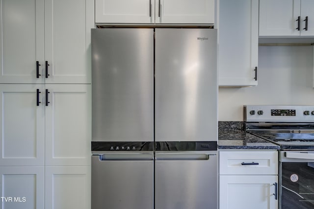 1105 Laurel Way, Mountain City, TN 37683 - kitchen featuring appliances with stainless steel finishes, white cabinetry, and dark stone countertops