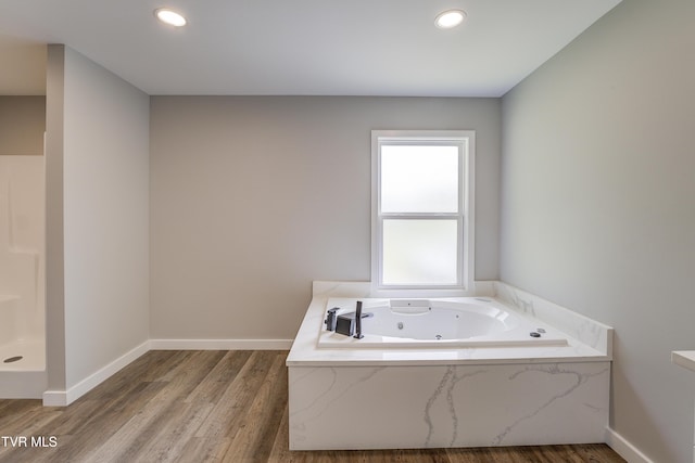 1105 Laurel Way, Mountain City, TN 37683 - full bath featuring a tub with jets, wood finished floors, baseboards, and recessed lighting