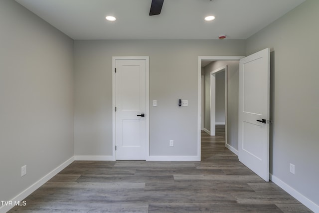 1105 Laurel Way, Mountain City, TN 37683 - unfurnished bedroom featuring recessed lighting, baseboards, wood finished floors, and a ceiling fan