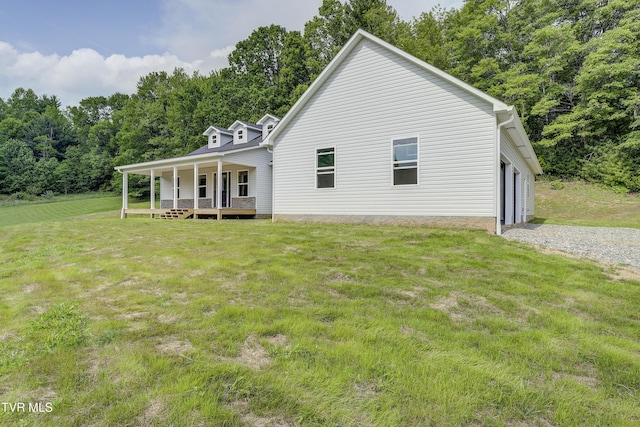 1105 Laurel Way, Mountain City, TN 37683 - back of property featuring a porch, a lawn, a garage, and gravel driveway