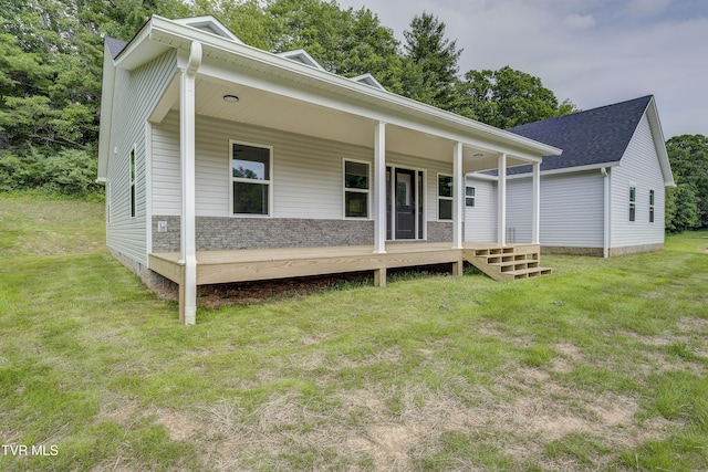 1105 Laurel Way, Mountain City, TN 37683 - view of front of house featuring a porch, a front yard, and a shingled roof