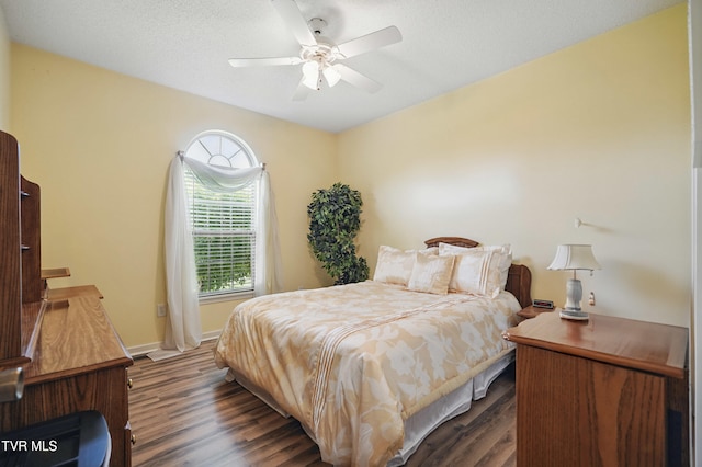 17308 Crabtree Ct, Bristol, VA 24202 - bedroom with dark wood-style flooring, ceiling fan, and baseboards