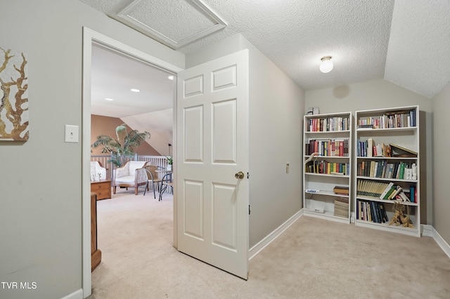 17308 Crabtree Ct, Bristol, VA 24202 - hall with carpet, lofted ceiling, attic access, baseboards, and a textured ceiling