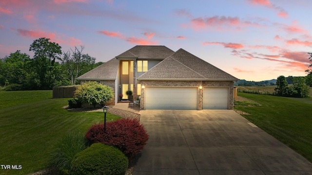 17308 Crabtree Ct, Bristol, VA 24202 - view of front of house with a garage, concrete driveway, a yard, brick siding, and roof with shingles