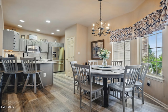 17308 Crabtree Ct, Bristol, VA 24202 - dining space with light wood finished floors, a chandelier, recessed lighting, and baseboards