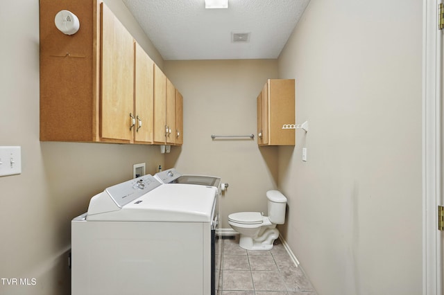 17308 Crabtree Ct, Bristol, VA 24202 - washroom featuring washing machine and clothes dryer, light tile patterned flooring, baseboards, and a textured ceiling