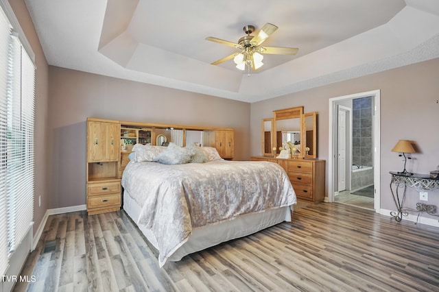 17308 Crabtree Ct, Bristol, VA 24202 - bedroom with a raised ceiling, baseboards, and wood finished floors