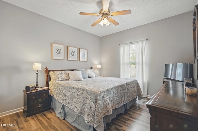 17308 Crabtree Ct, Bristol, VA 24202 - bedroom featuring wood finished floors, baseboards, a textured ceiling, and ceiling fan