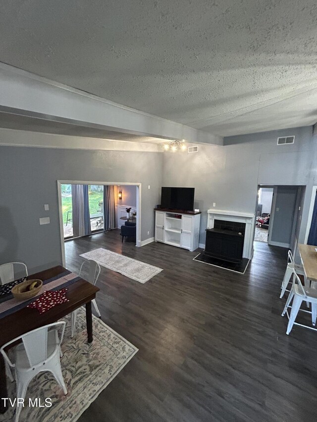 172 Dakota Rd, Bristol, VA 24201 - living room featuring a textured ceiling and dark wood finished floors