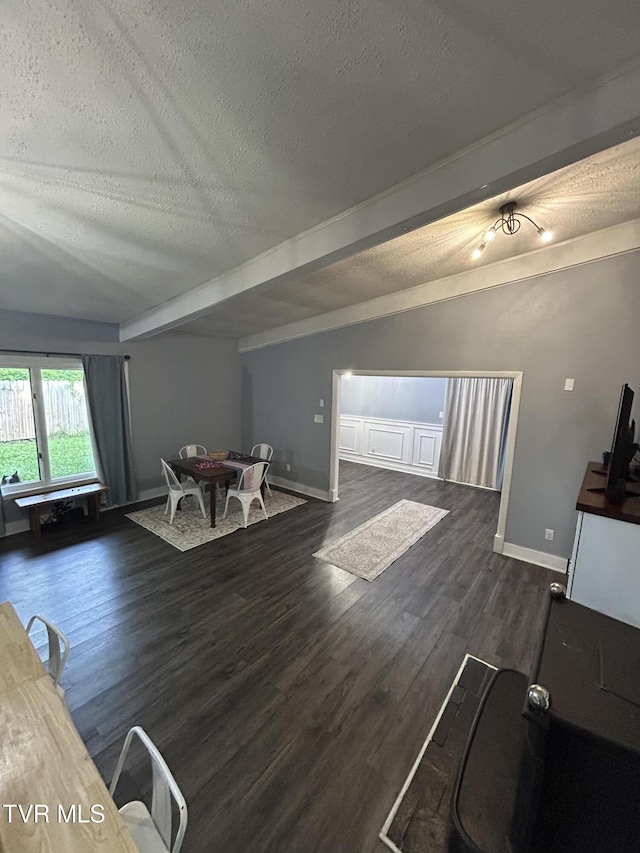 172 Dakota Rd, Bristol, VA 24201 - living room with a textured ceiling, beamed ceiling, and wood finished floors