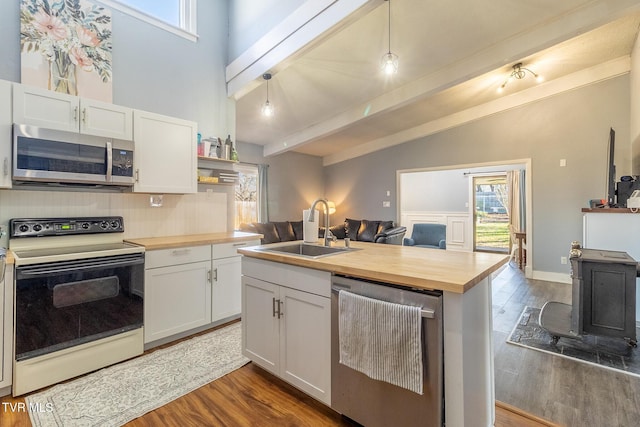 172 Dakota Rd, Bristol, VA 24201 - kitchen featuring appliances with stainless steel finishes, wooden counters, white cabinets, dark wood-style floors, and open floor plan