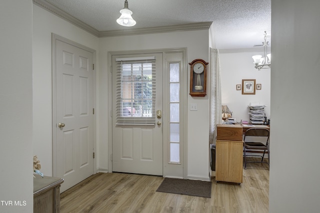 1905 Knob Creek Rd Unit 11, Johnson City, TN 37604 - foyer featuring light wood-type flooring, ornamental molding, a chandelier, and a textured ceiling