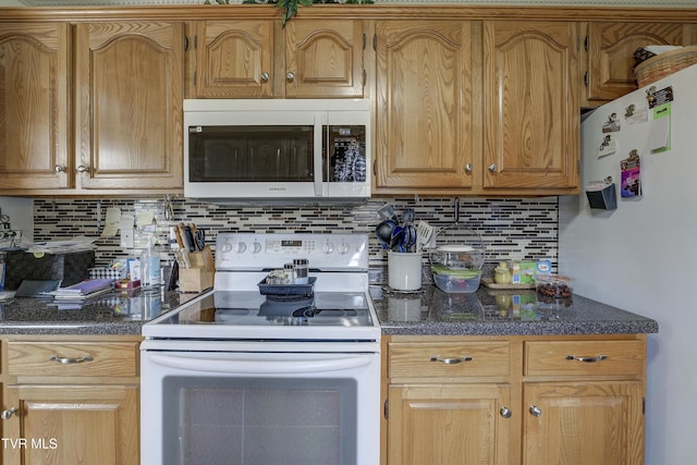 1905 Knob Creek Rd Unit 11, Johnson City, TN 37604 - kitchen featuring white appliances, tasteful backsplash, and dark countertops