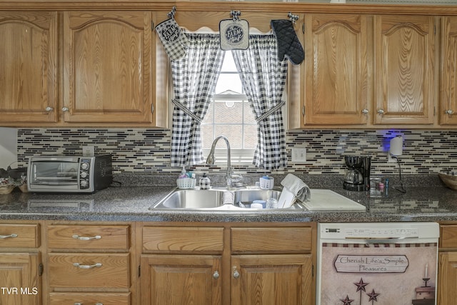 1905 Knob Creek Rd Unit 11, Johnson City, TN 37604 - kitchen with white dishwasher, backsplash, and dark countertops