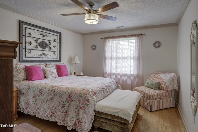 1905 Knob Creek Rd Unit 11, Johnson City, TN 37604 - bedroom featuring wood finished floors, a textured ceiling, crown molding, and a ceiling fan