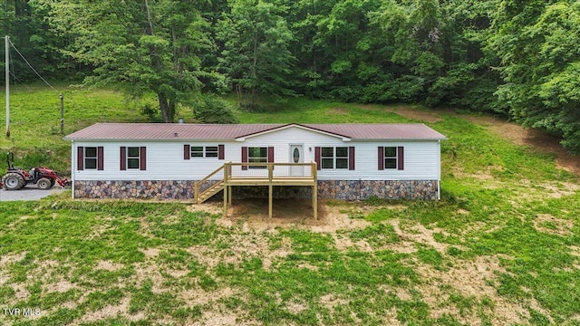 14450 Rattle Creek Rd, Abingdon, VA 24210 - back of house with a deck, metal roof, a wooded view, and a lawn