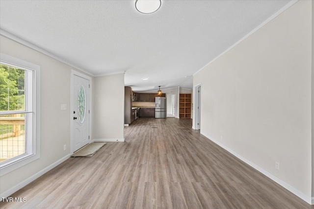14450 Rattle Creek Rd, Abingdon, VA 24210 - unfurnished living room with wood finished floors, ornamental molding, baseboards, and a textured ceiling