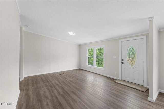 14450 Rattle Creek Rd, Abingdon, VA 24210 - foyer entrance with ornamental molding, wood finished floors, baseboards, and a textured ceiling