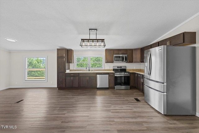 14450 Rattle Creek Rd, Abingdon, VA 24210 - kitchen with stainless steel appliances, a sink, light countertops, dark brown cabinets, and dark wood finished floors