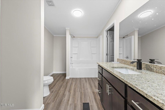 14450 Rattle Creek Rd, Abingdon, VA 24210 - full bath with wood finished floors, toilet, vanity, baseboards, and ornamental molding