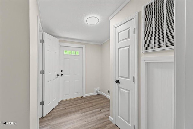 14450 Rattle Creek Rd, Abingdon, VA 24210 - entrance foyer with light wood-style floors, baseboards, crown molding, and a textured ceiling