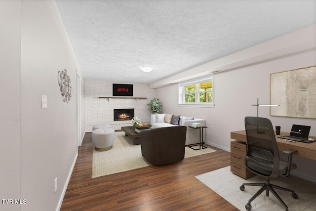 152 Ezee St, Elizabethton, TN 37643 - office space with wood finished floors, a fireplace, and a textured ceiling