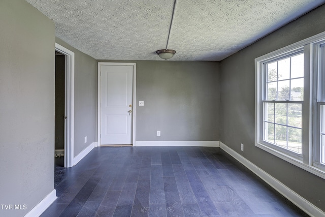 3912 Memorial Blvd, Kingsport, TN 37664 - unfurnished room featuring a textured ceiling and dark wood-style flooring