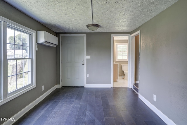 3912 Memorial Blvd, Kingsport, TN 37664 - unfurnished dining area with a wall unit AC and dark wood-type flooring