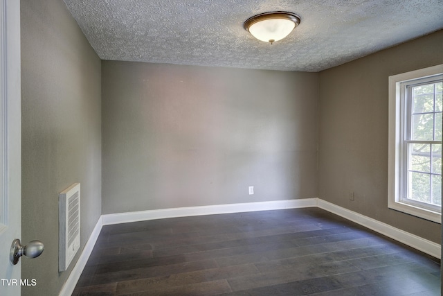 3912 Memorial Blvd, Kingsport, TN 37664 - empty room featuring dark wood-style floors and a textured ceiling