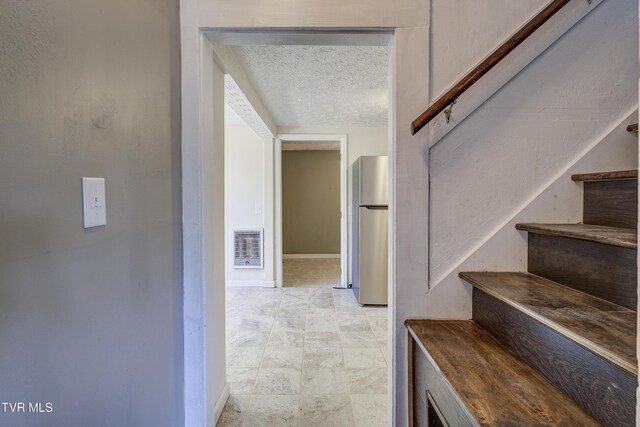 3912 Memorial Blvd, Kingsport, TN 37664 - staircase featuring a textured ceiling and baseboards
