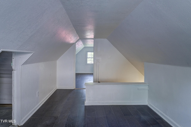 3912 Memorial Blvd, Kingsport, TN 37664 - additional living space featuring wood-type flooring, lofted ceiling, and a textured ceiling