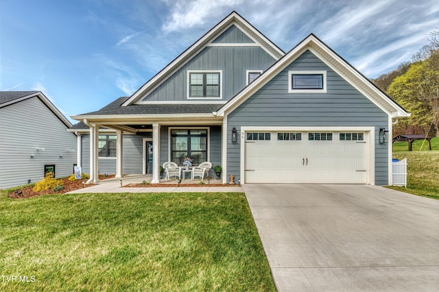 85 Slonaker Cir, Jonesborough, TN 37659 - view of front of house featuring board and batten siding, a porch, driveway, and a front lawn