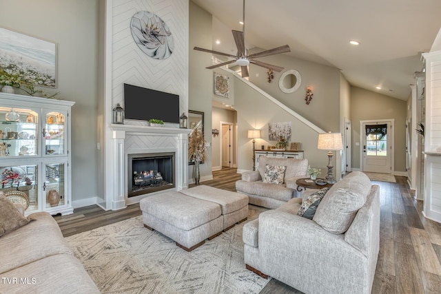 85 Slonaker Cir, Jonesborough, TN 37659 - living area featuring high vaulted ceiling, a large fireplace, wood finished floors, a ceiling fan, and recessed lighting