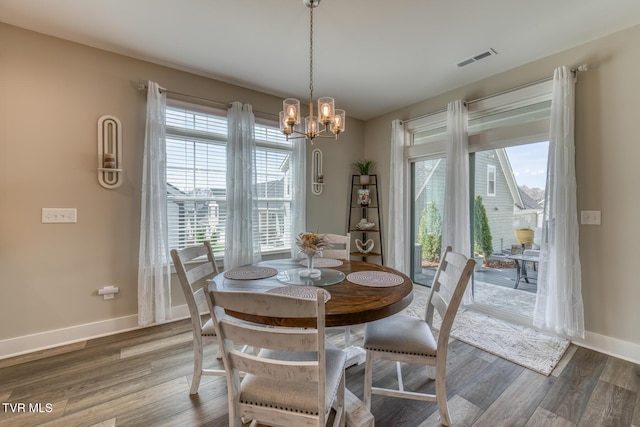 85 Slonaker Cir, Jonesborough, TN 37659 - dining area with plenty of natural light, wood finished floors, baseboards, and a chandelier