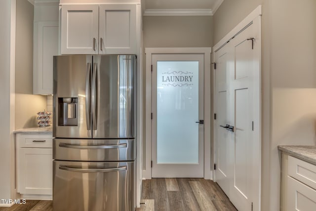 85 Slonaker Cir, Jonesborough, TN 37659 - kitchen featuring stainless steel fridge with ice dispenser, ornamental molding, wood finished floors, and white cabinetry