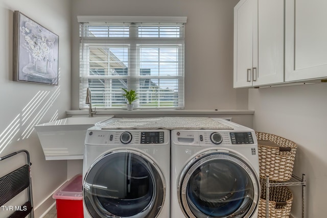 85 Slonaker Cir, Jonesborough, TN 37659 - laundry room featuring separate washer and dryer, healthy amount of natural light, and cabinet space
