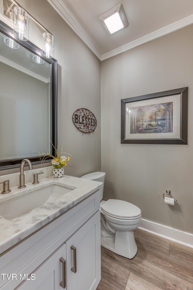 85 Slonaker Cir, Jonesborough, TN 37659 - half bathroom featuring toilet, crown molding, vanity, wood finished floors, and baseboards