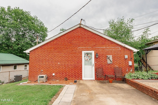 2009 Tenneva St, Kingsport, TN 37665 - back of property featuring a patio area, brick siding, central AC, and ac unit