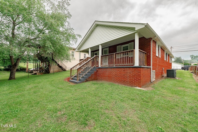 2009 Tenneva St, Kingsport, TN 37665 - view of front of property with brick siding, stairs, a porch, and central AC unit