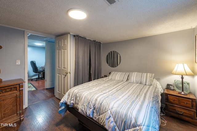 2009 Tenneva St, Kingsport, TN 37665 - bedroom featuring wood finished floors, a textured ceiling, crown molding, and a desk