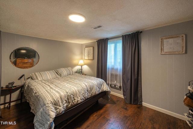 2009 Tenneva St, Kingsport, TN 37665 - bedroom featuring a textured ceiling, wood finished floors, baseboards, and ornamental molding