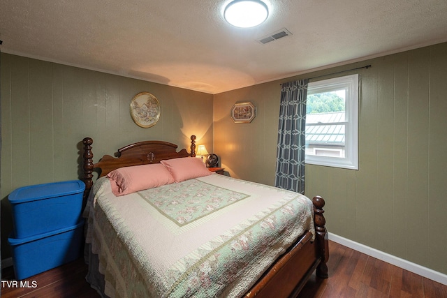 2009 Tenneva St, Kingsport, TN 37665 - bedroom with wood finished floors, baseboards, a textured ceiling, and wooden walls