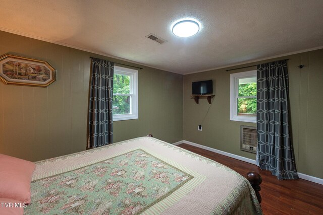 2009 Tenneva St, Kingsport, TN 37665 - bedroom featuring wood finished floors, crown molding, baseboards, and heating unit