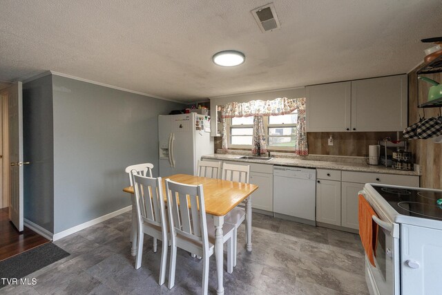 2009 Tenneva St, Kingsport, TN 37665 - kitchen featuring white appliances, a sink, light countertops, white cabinets, and a textured ceiling