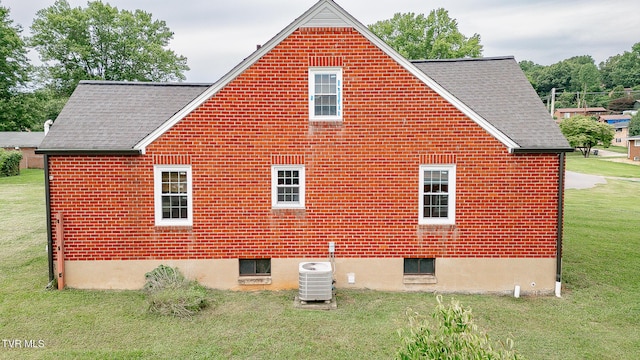 1024 Sharondale Ave, Kingsport, TN 37660 - view of property exterior featuring a shingled roof, central AC, and a yard